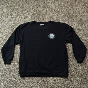 This Ron Jon crewneck is a women’s large and dark grey color